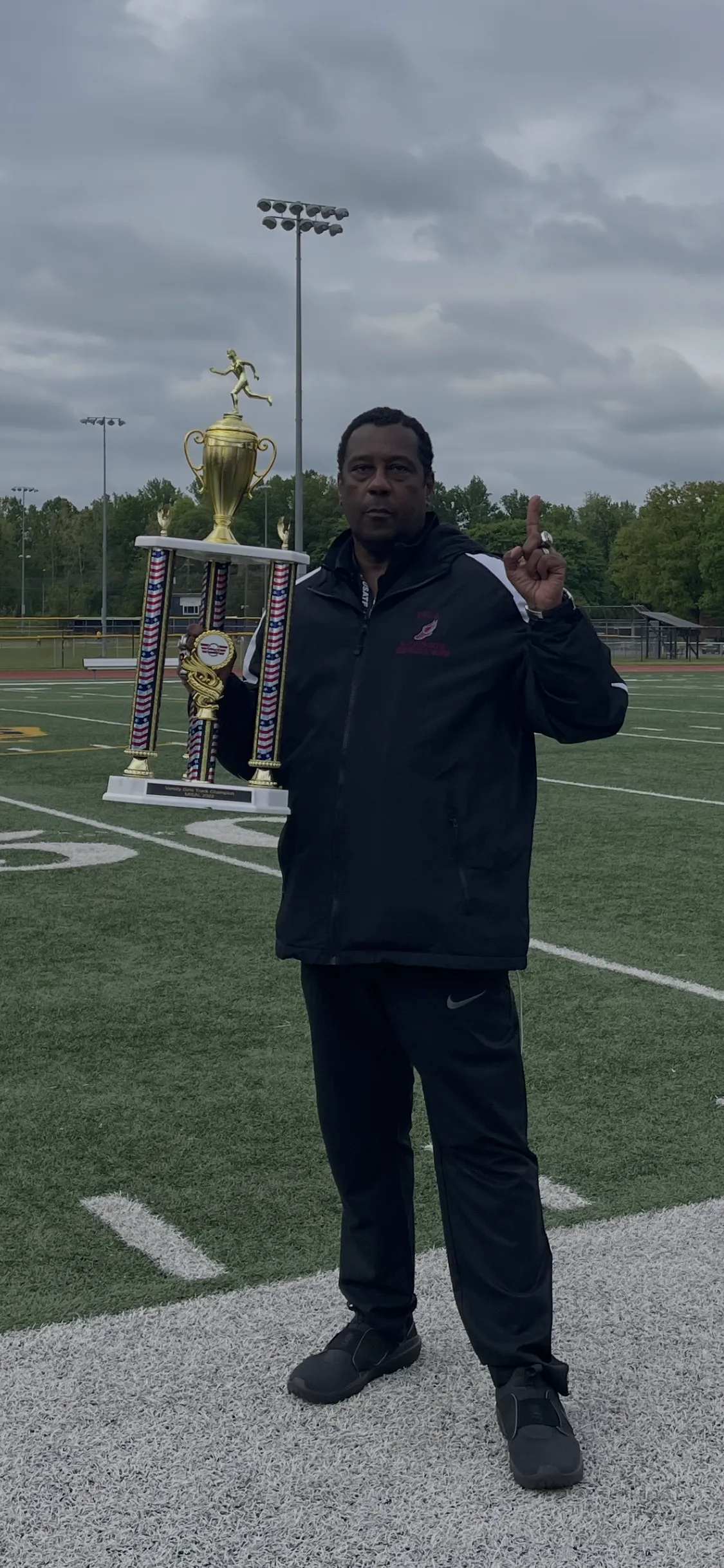 Coach Dr. Kevin Wilbon Sr. with Championship Trophy