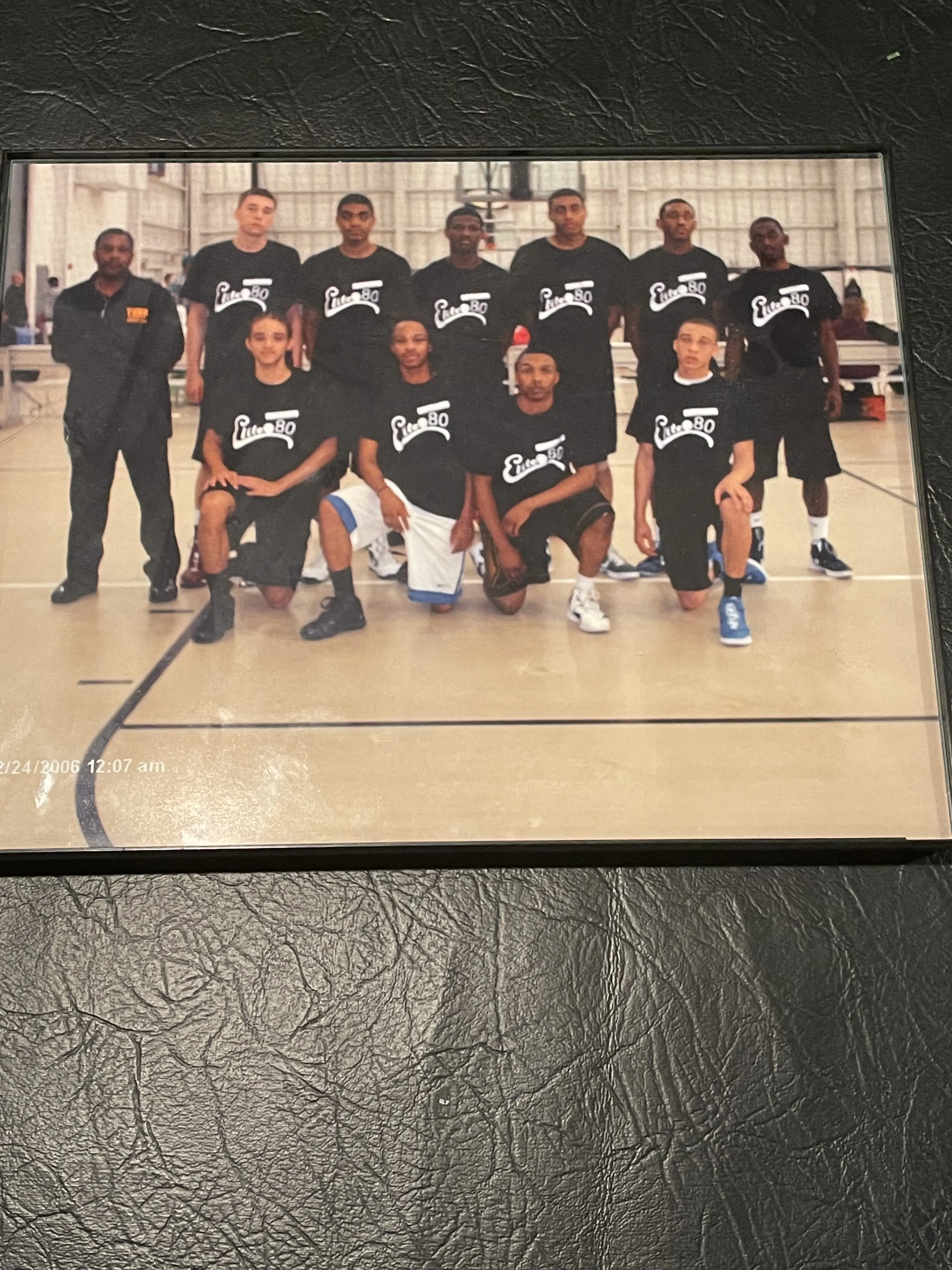 Team standing on basketball court line photo