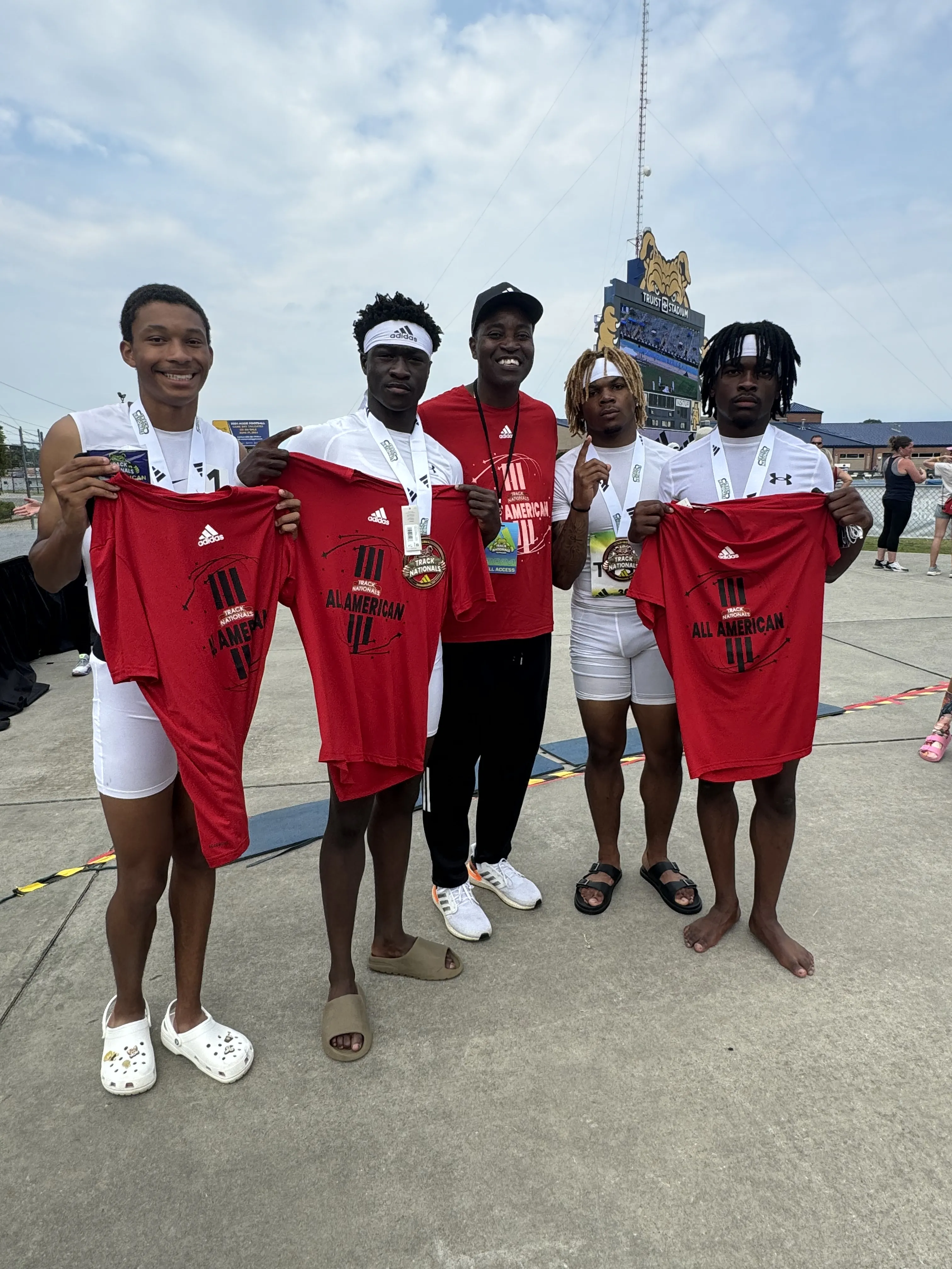 Athletes posing with medals layout line
